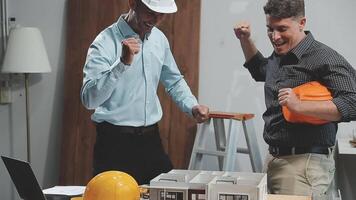 Teamwork men in construction site, Two civil engineer or professional foreman in safety helmet hard hat using blueprint in digital tablet working while standing at industrial factory, teamwork concept video