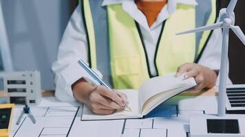 Architect working on blueprint.engineer inspective in workplace - architectural project, blueprints,ruler,calculator,laptop and divider compass. Construction concept. Engineering tools, video