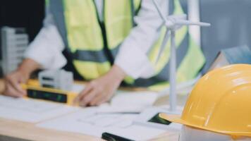 Architect working on blueprint.engineer inspective in workplace - architectural project, blueprints,ruler,calculator,laptop and divider compass. Construction concept. Engineering tools, video
