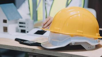 Architect working on blueprint.engineer inspective in workplace - architectural project, blueprints,ruler,calculator,laptop and divider compass. Construction concept. Engineering tools, video