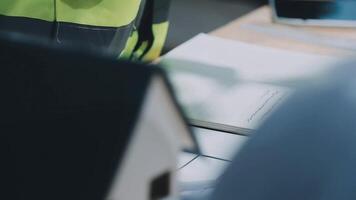 Architect working on blueprint.engineer inspective in workplace - architectural project, blueprints,ruler,calculator,laptop and divider compass. Construction concept. Engineering tools, video