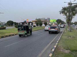 low angle view of city traffic in Lahore, Pakistan on June 3, 2024. photo