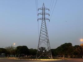 Transmission Lines and tower for transmitting electricity in Lahore, Pakistan on June 4, 2024. photo