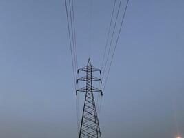 Transmission Lines and tower for transmitting electricity in Lahore, Pakistan on June 4, 2024. photo