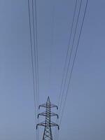 Transmission Lines and tower for transmitting electricity in Lahore, Pakistan on June 4, 2024. photo