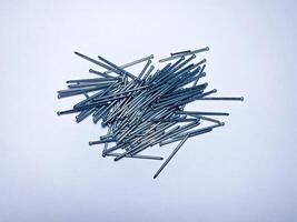 Finishing galvanized nails for high-quality fasteners of such materials as skirting boards, shtapik, parquet, platbands lining photo