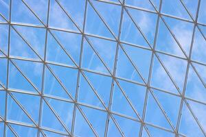 A fragment of a glass dome on the roof of the building. Geometric glass dome. Modern ceiling architecture photo