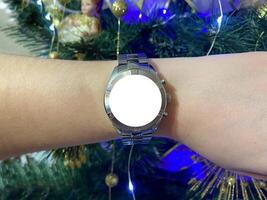 A view of the quartz watch dial with a stainless steel strap on the arm with a mockup photo