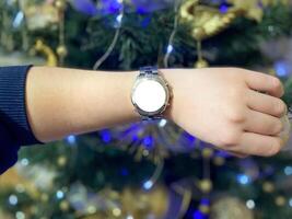 A view of the quartz watch dial with a stainless steel strap on the arm with a mockup photo