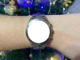 A view of the quartz watch dial with a stainless steel strap on the arm with a mockup photo