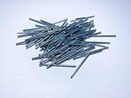 Finishing galvanized nails for high-quality fasteners of such materials as skirting boards, shtapik, parquet, platbands lining photo