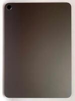 The tablet is black on a white isolated background with a mock up. Back side view of the tablet photo