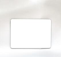 The tablet is black on a white isolated background with a mock up. Back side view of the tablet photo
