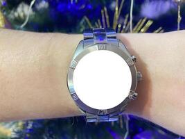 A view of the quartz watch dial with a stainless steel strap on the arm with a mockup photo