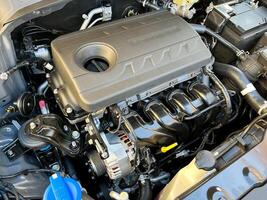 The engine compartment of the car, a view of the engine. Four-cylinder engine photo