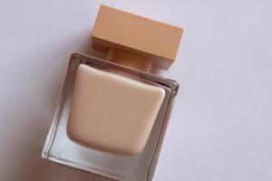 Close-up of a set of perfumed water, cream-colored shower gel in a gift box . Close-up photo on a white background