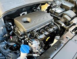 The engine compartment of the car, a view of the engine. Four-cylinder engine photo