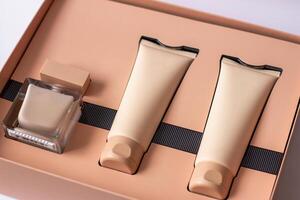 Close-up of a set of perfumed water, cream-colored shower gel in a gift box . Close-up photo on a white background