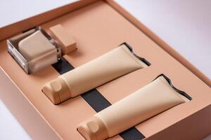 Close-up of a set of perfumed water, cream-colored shower gel in a gift box . Close-up photo on a white background