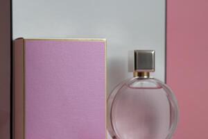 Perfume bottle from a pink box on an isolated background with mockup and copyspace photo