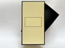A bottle of perfume from a yellow box on a white isolated background photo