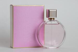 Perfume bottle from a pink box on an isolated background with mockup and copyspace photo