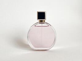 Perfume bottle from a pink box on an isolated background with mockup and copyspace photo