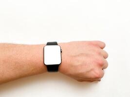 View of the smart watch screen on your hand with mockup on a white isolated background photo