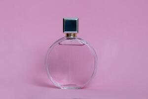 Perfume bottle from a pink box on an isolated background with mockup and copyspace photo