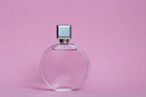 Perfume bottle from a pink box on an isolated background with mockup and copyspace photo