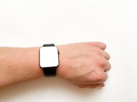 View of the smart watch screen on your hand with mockup on a white isolated background photo