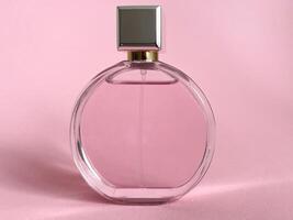Perfume bottle from a pink box on an isolated background with mockup and copyspace photo