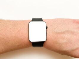 View of the smart watch screen on your hand with mockup on a white isolated background photo