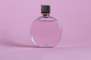 Perfume bottle from a pink box on an isolated background with mockup and copyspace photo