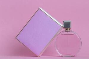 Perfume bottle from a pink box on an isolated background with mockup and copyspace photo