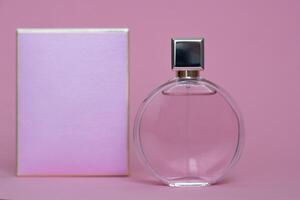 Perfume bottle from a pink box on an isolated background with mockup and copyspace photo