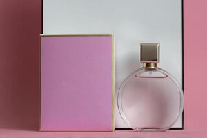 Perfume bottle from a pink box on an isolated background with mockup and copyspace photo