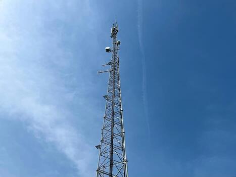 A base station in radio communications, mobile communications tower, is a system complex of transceiver equipment that provides centralized maintenance of a group of terminal subscriber devices photo