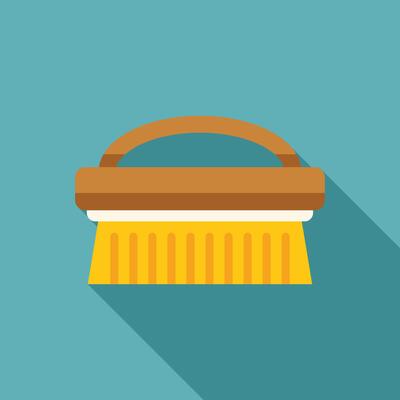 Cleaning brush with long shadow is laying on blue background