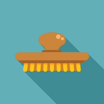 Cleaning brush with yellow bristles and wooden handle on blue background