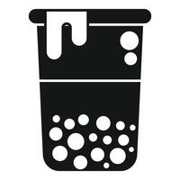 Plastic cup with boba tea and dripping cream is being held vector