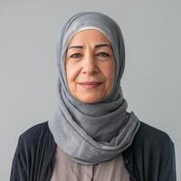 Portrait of a Middle-Aged Woman Wearing a Grey Hijab photo