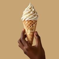 Hand Holding a Vanilla Ice Cream Cone Against a Beige Background photo