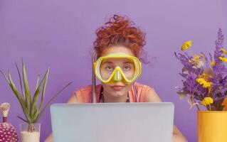 A Woman With A Snorkel And Dive Mask Looks At Her Laptop Screen In Front Of A Purple Background photo
