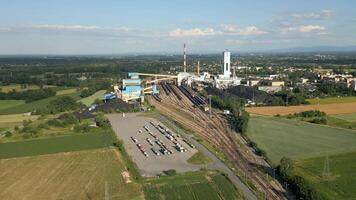 Aerial view of coal mine with coal heaps and trucks waiting for loading, Poland video