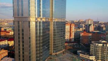 Drone view of a modern skyscraper located in the center of Vladivostok video