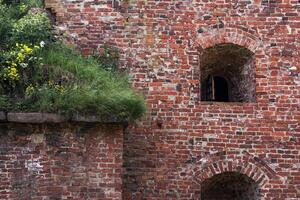 vintage architectural background, fragment of a brick wall of an old castle photo