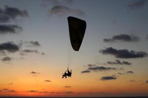 Flying on a wing over the Mediterranean Sea photo