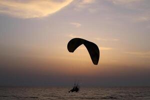 Flying on a wing over the Mediterranean Sea photo