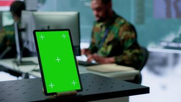 US soldiers working in a top secret operation room with copy space on screen, ensuring national safety while studying surveillance imagery from satellite cctv. Control tower. Camera A. video